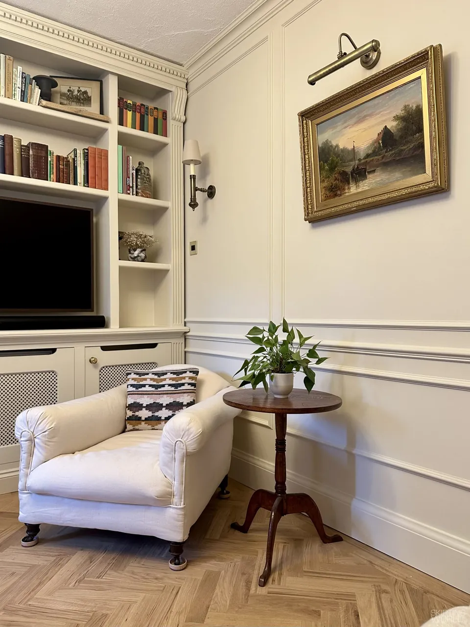 Lambs Tongue 2 pine skirting board and wall panelling in a customer's living room with a herringbone floor.