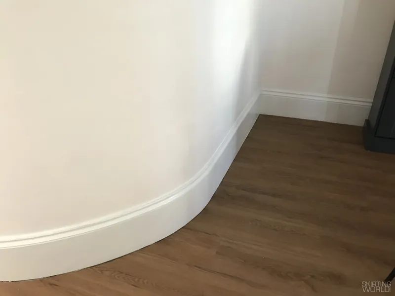 Mini Ogee 1 MDF skirting board fitted round a curved wall.